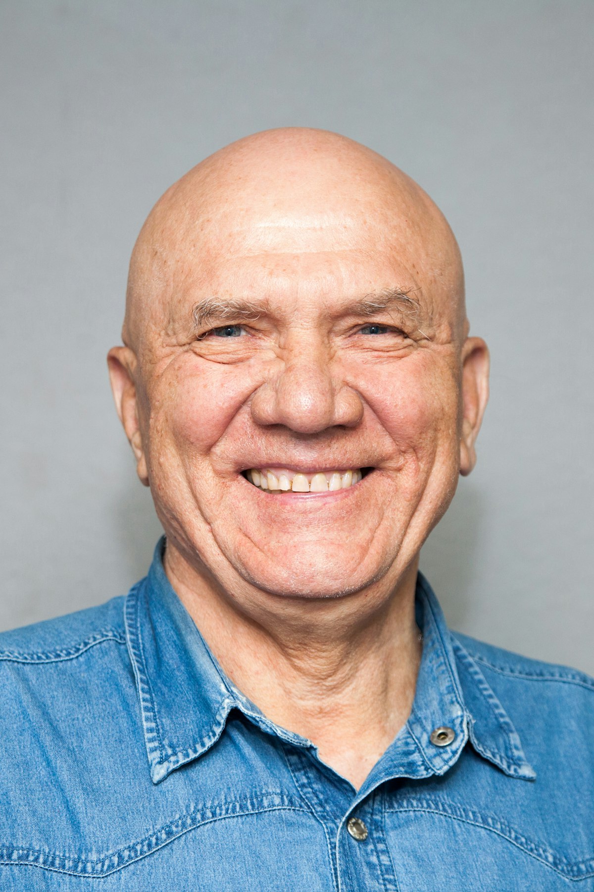 Smiling man in a denim shirt